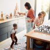 image shows family in a kitchen and is featured in an article Family Kitchen Safety Made Simple: Expert Tips and Essential Gadgets for 2025